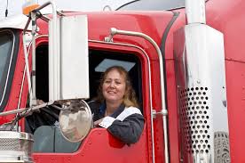 Truck driver in her truck with an Indiana IRP license plate, Indiana IRP plate, Indiana IRP